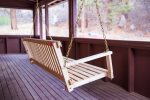 Porch swing on a large back porch, perfect for those cool summer nights.